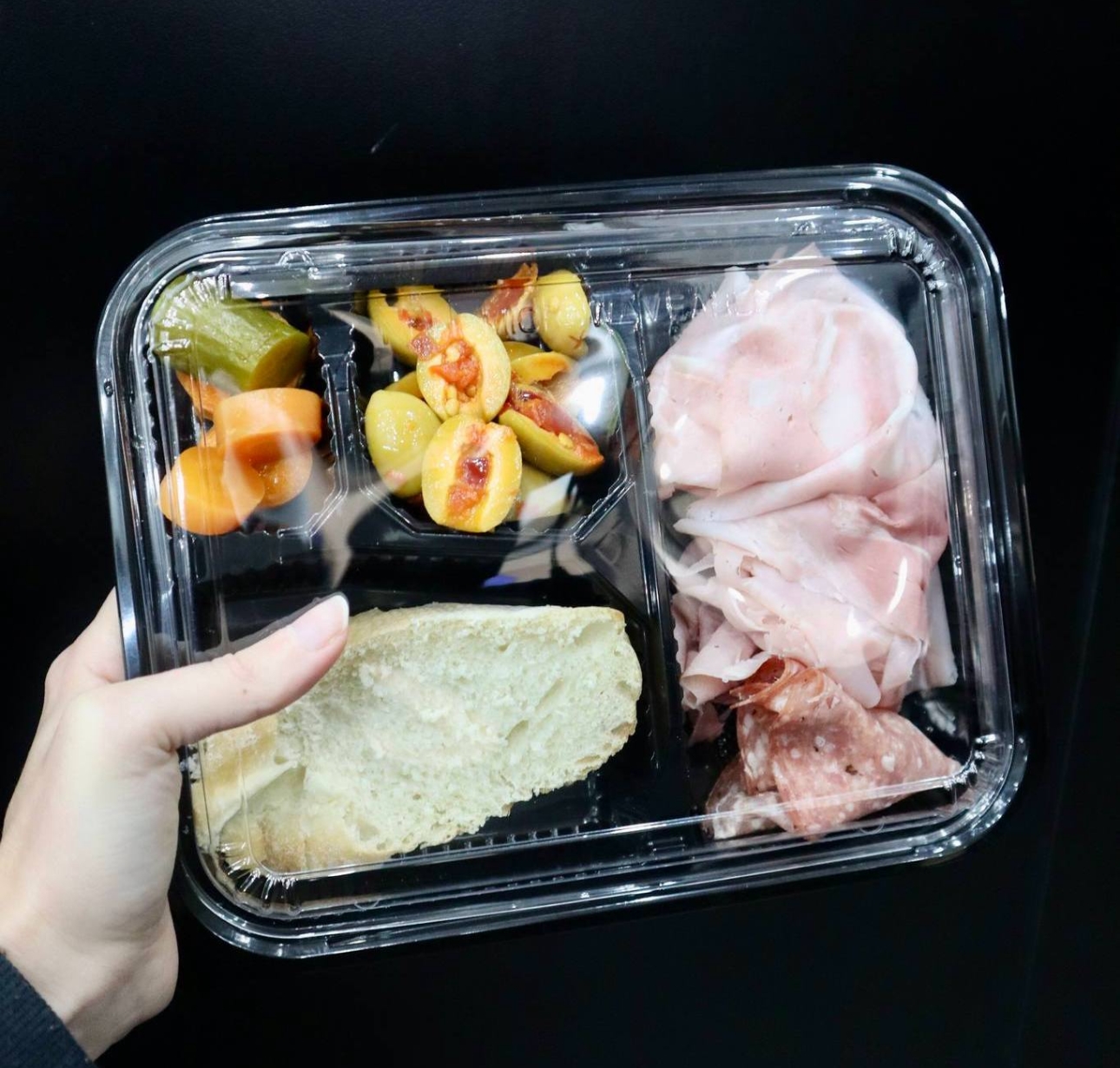 The DeliCut Pickle bento box with deli meats, bread, olives and pickles